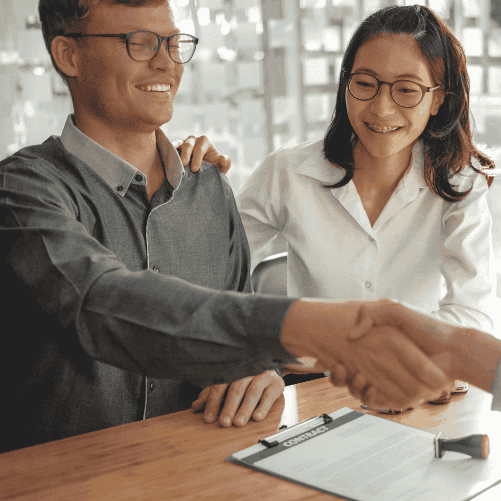 Couple Customer Shaking Hands with Insurance Mortgage Broker Law