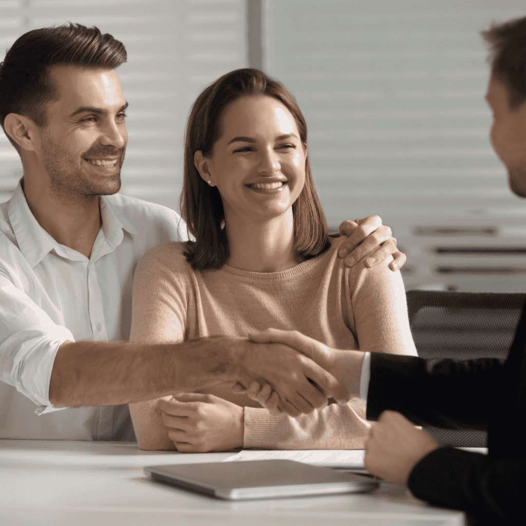 Happy young couple handshake lawyer insurer broker make business deal